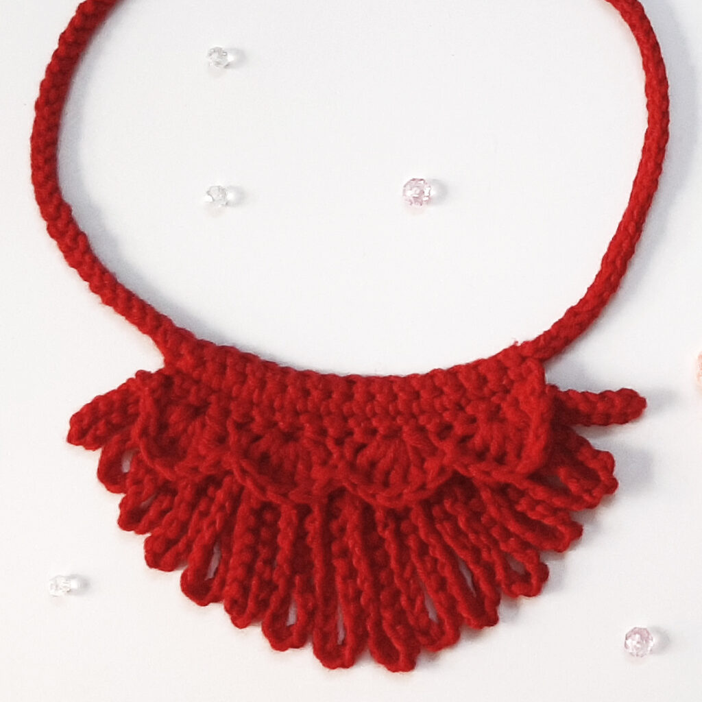 The Loopy Crochet Necklace in one color.  This pattern can be customized for any outfit, holiday, or personality.  