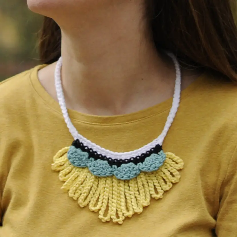 Add excitement to your wardrobe with the Loopy Worsted Necklace by Crochet with Mary Beth.