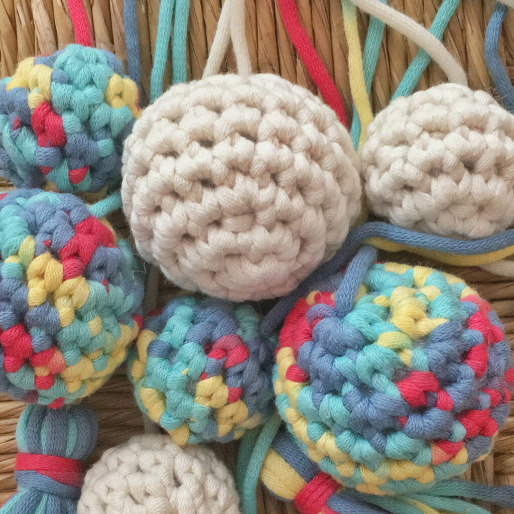 Bernat Maker Home Dec Yarn made into festive balls and tassels.