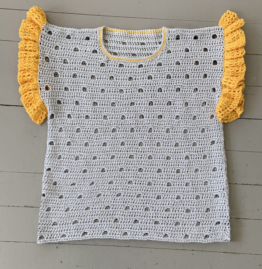 The light airy stitch makes this crochet tee cool and comfortable to wear in warm weather.