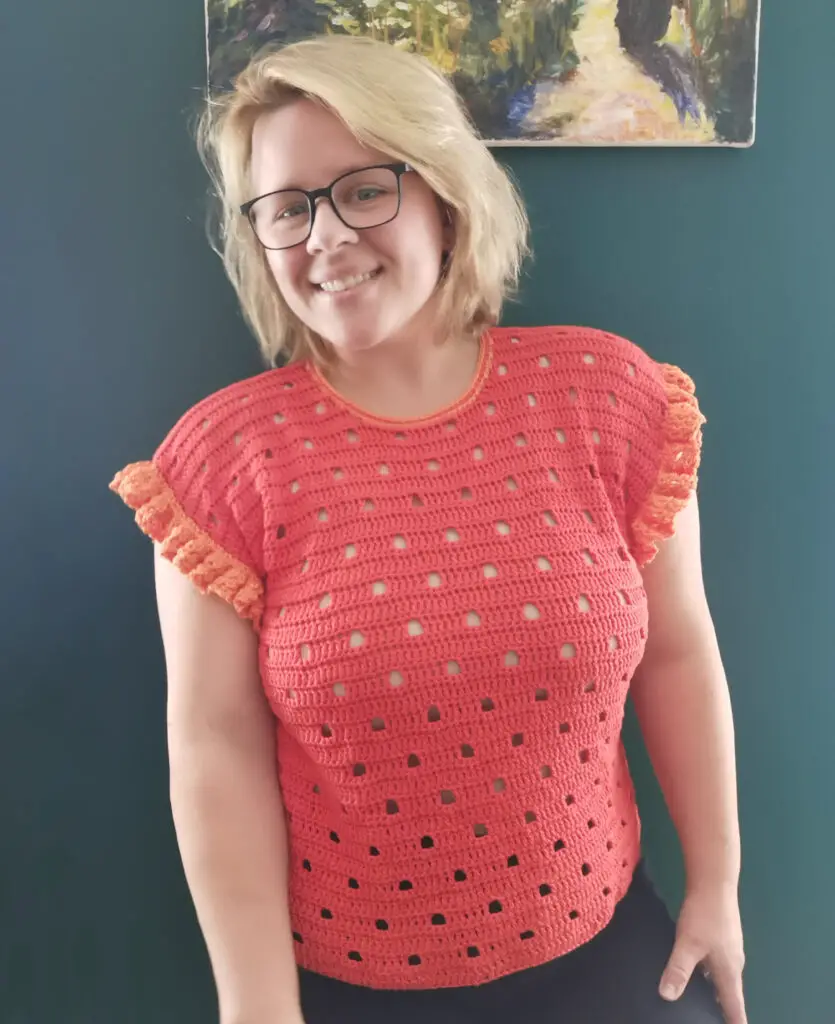 A Hot Cup of Coffee looks fantastic in her red and orange version of the Be Spotted Tee.