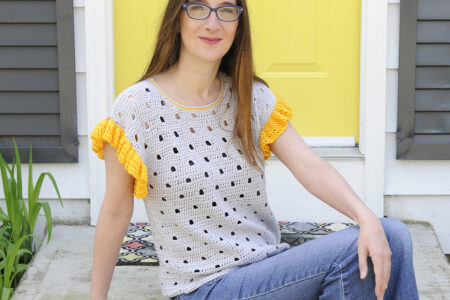 A woman wearing the Be Spotted Crochet Tee. A garment by Mary Beth Cryan