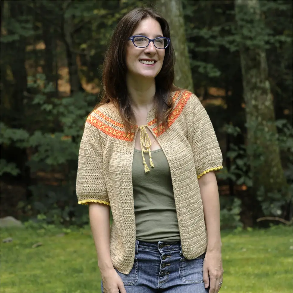 Woman wearing the completed In Stitches Crochet Cardigan pattern.
