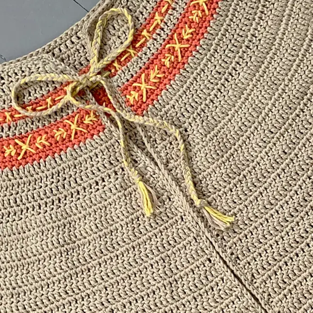 Close up of embroidery on crochet.