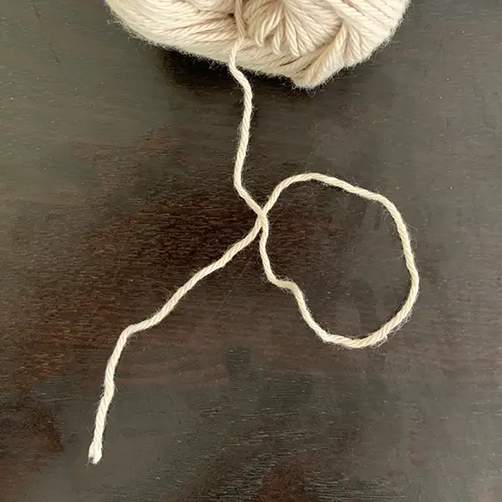 A peice of yarn shaped into an O.