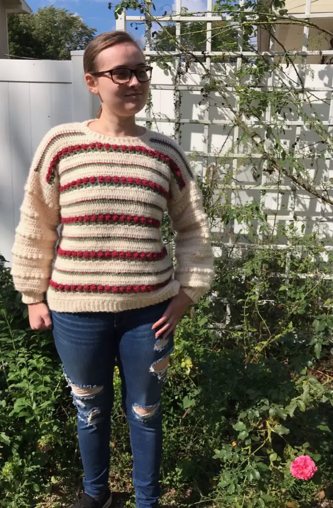 MendlarHollyAnn models her Rose on Repeat crochet jumper pattern.