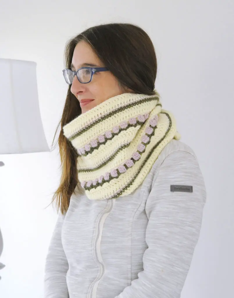 The Roses on Repeat Scarf worn by Mary Beth of Crochet with Mary Beth. The scarf is thick and warm because it wraps around the neck twice.