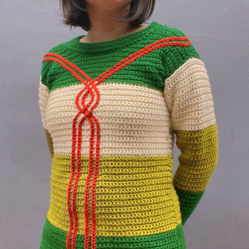 A multicolor modern crochet sweater pattern designed by Mary Beth Cryan called the Draw the line crochet sweater.