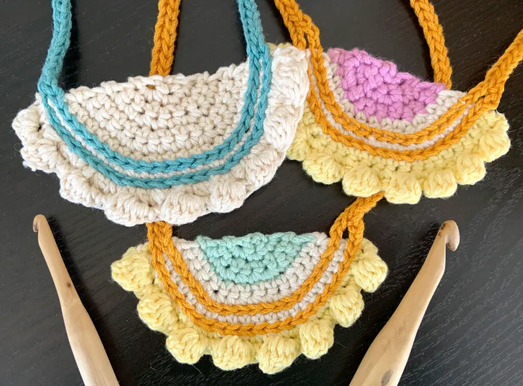 Three Eight Bobble Crochet Necklaces made from a crochet jewelry pattern. The necklaces make quick crochet gifts.