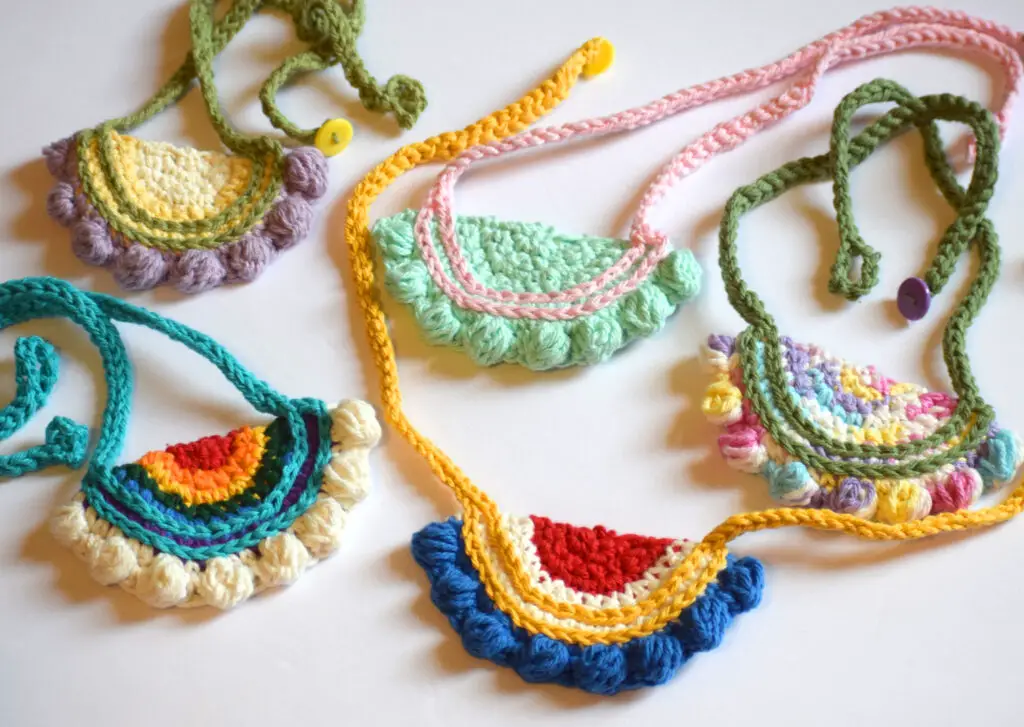 5 crochet necklaces, one pastel, one variegated, one rainbow, one mint, one primary colors
