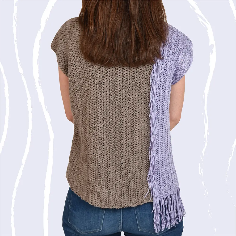 The back of the crochet t shirt pattern is the same as the front and features creative colorblocking and customizable funky fringe.