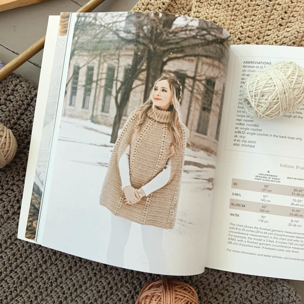A beautiful photo of Janine Myska wearing a capelet from her crochet book Modern Crochet Sweaters