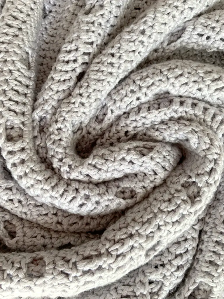 A swirl of crochet fabric made out of Lion Brand Truboo Yarn